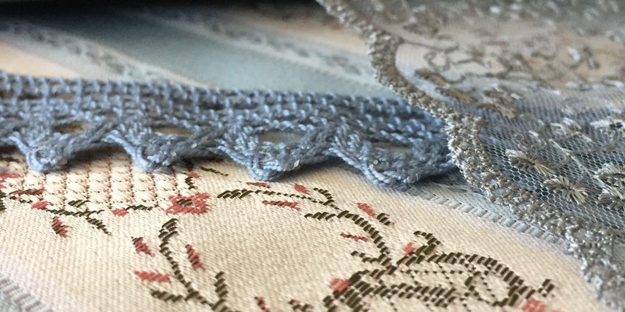 grey and blue fabric and lace